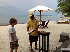 Young Boy At Tourist Display On The Beach